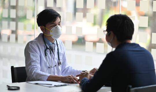 Doctor talking to patient