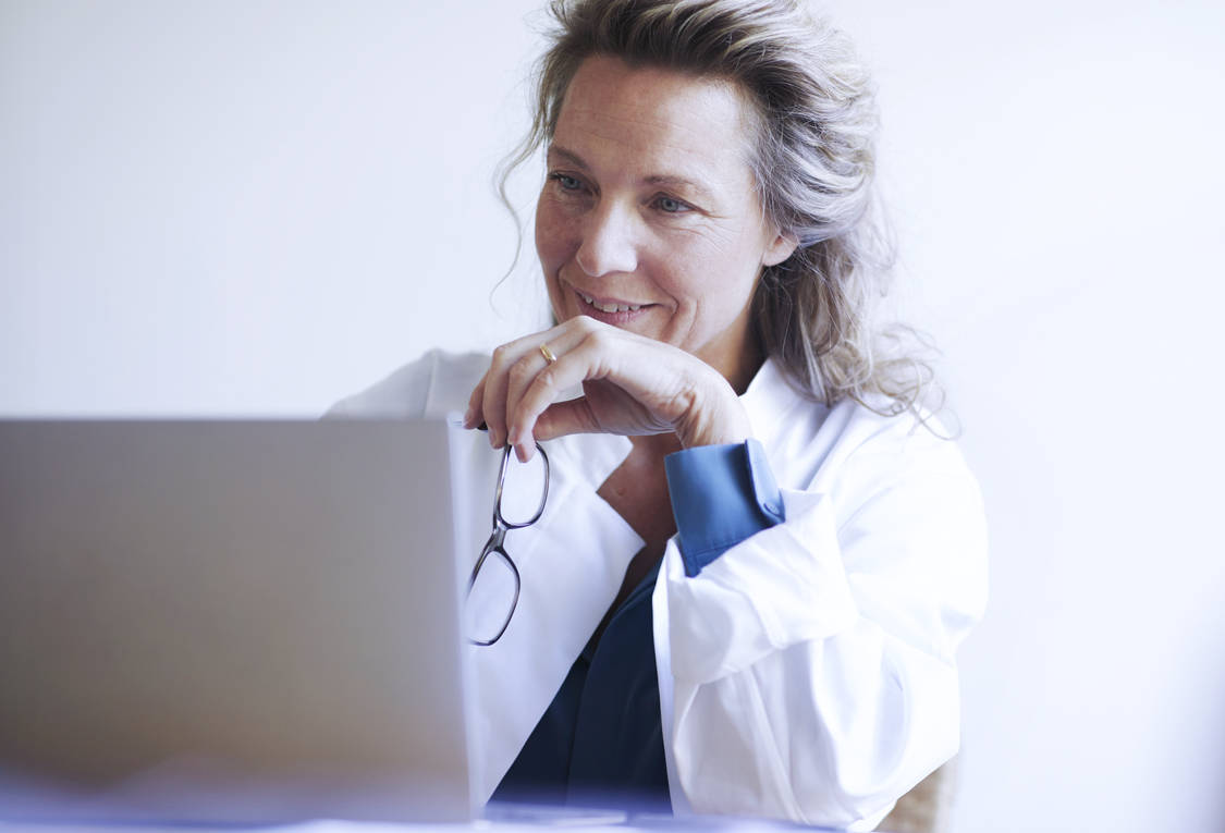 Female doc at computer_GettyImages-1224302214_RGB_flipped