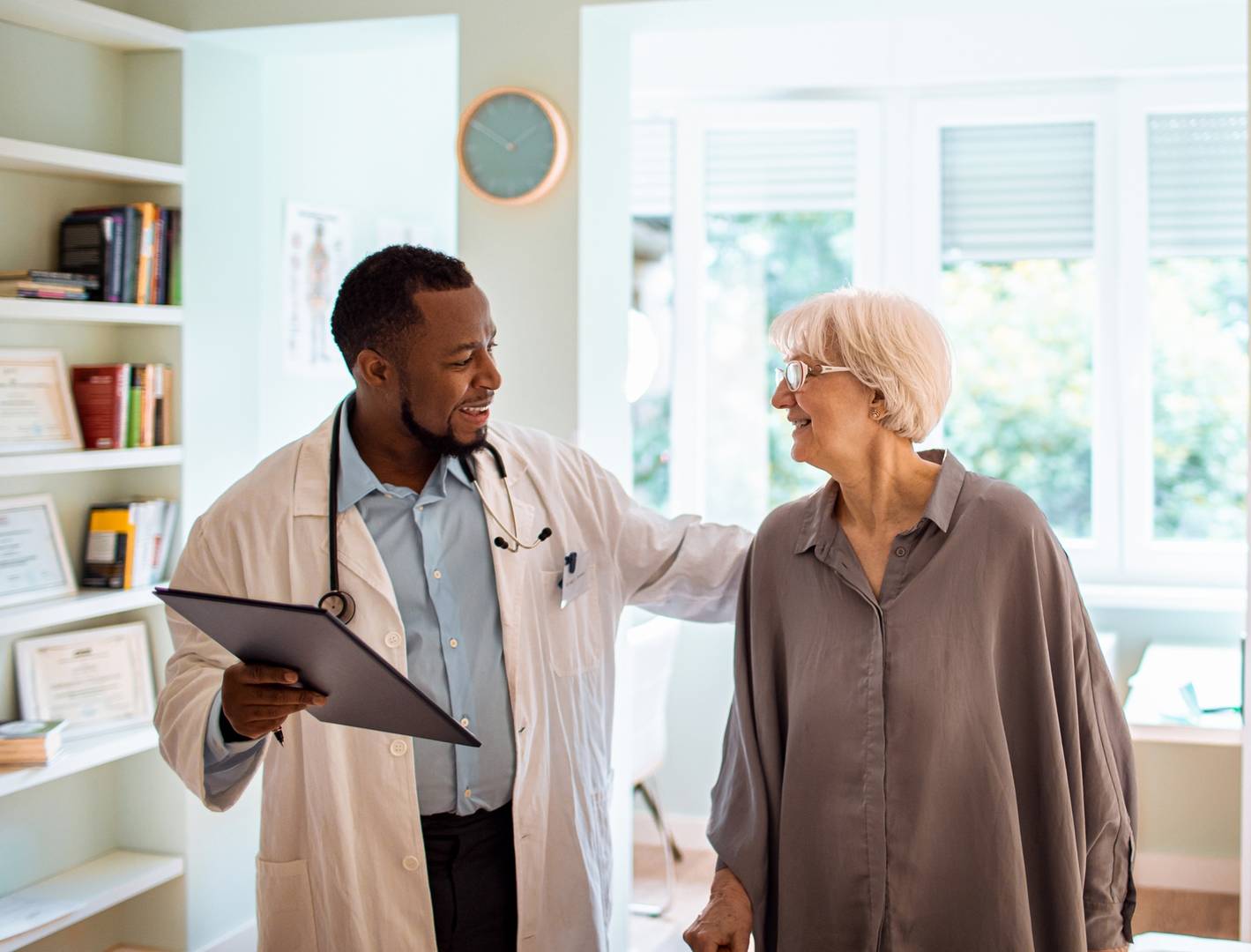 Dr and elderly female pt_iStock-1254897816_cropped