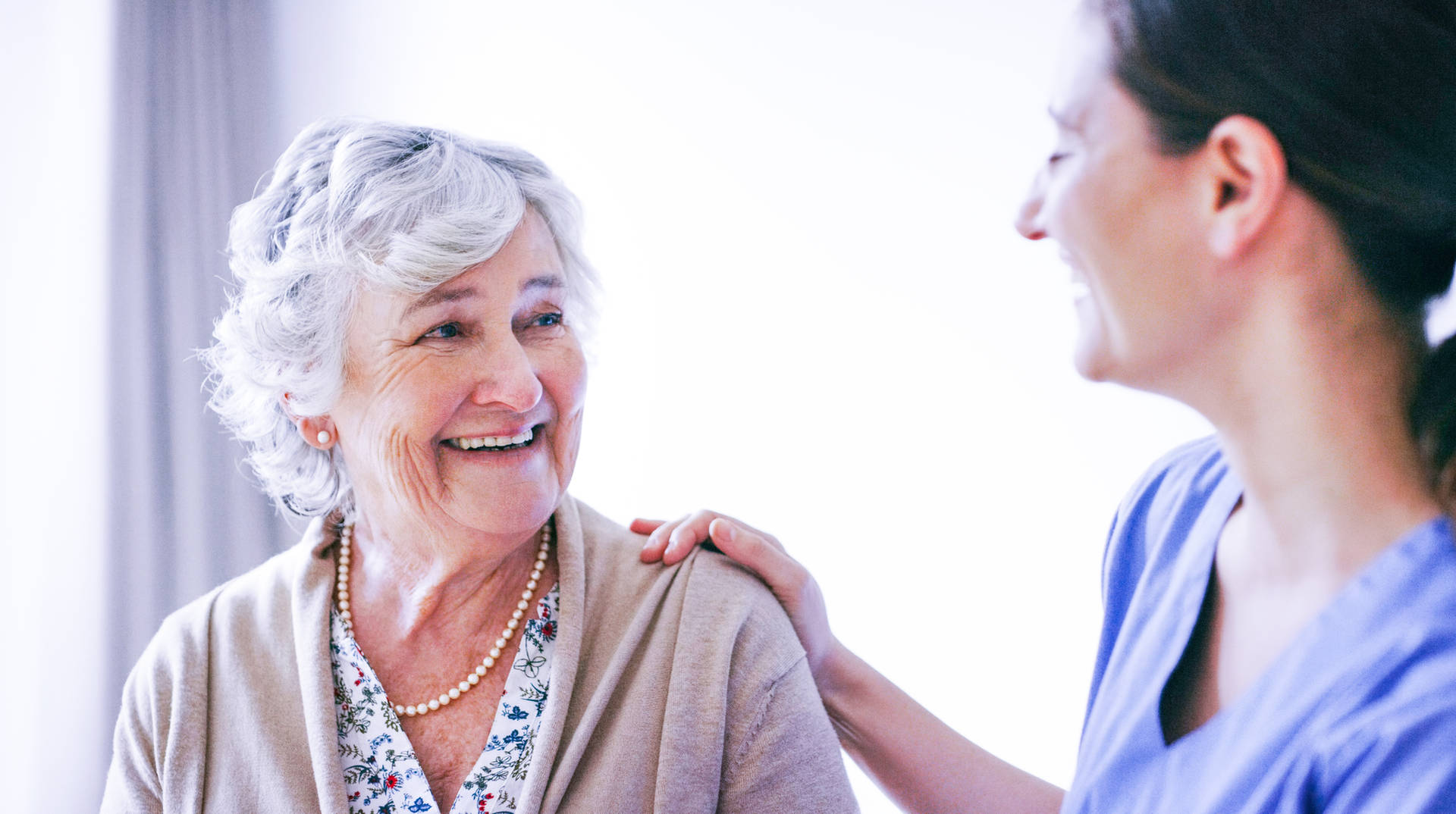 Elderly female pt and nurse_GettyImages-1165979798