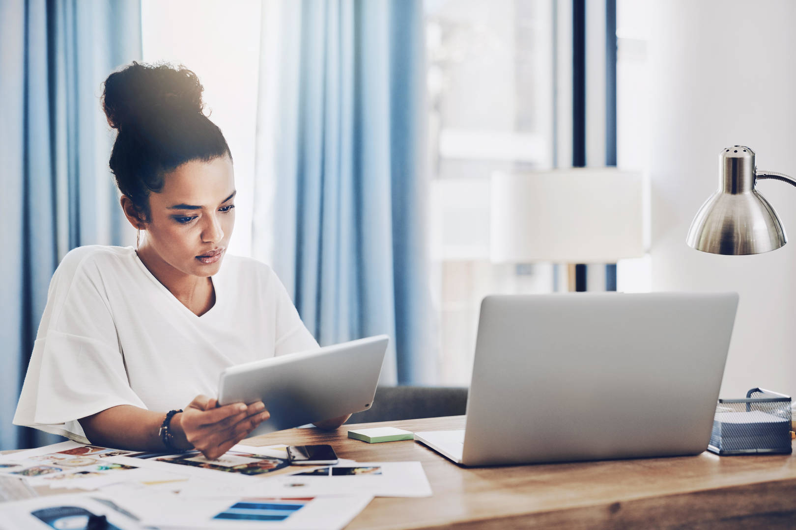 Female with tablet and laptop
